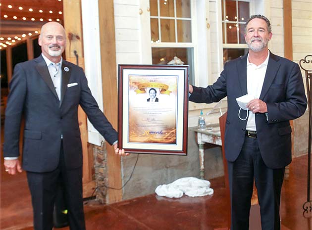 DR. JOHN JAGGERS, right, pulmonologist and founding member of Blue Ridge Pulmonary Medicine, is presented his plaque for being chosen as the 2021 Community First Awards Person of the Year, by Dr. Bill Seymour, president of Cleveland State Community College. BANNER PHOTO, DANIEL GUY