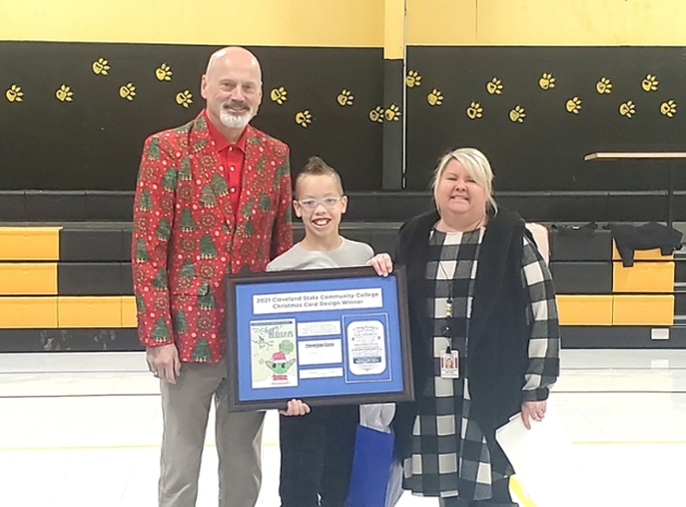 Pictured from left to right: Dr. Bill Seymour, CSCC President, Ellis Williams, student, and Erica Shamblin, Taylor Elementary School Principal.